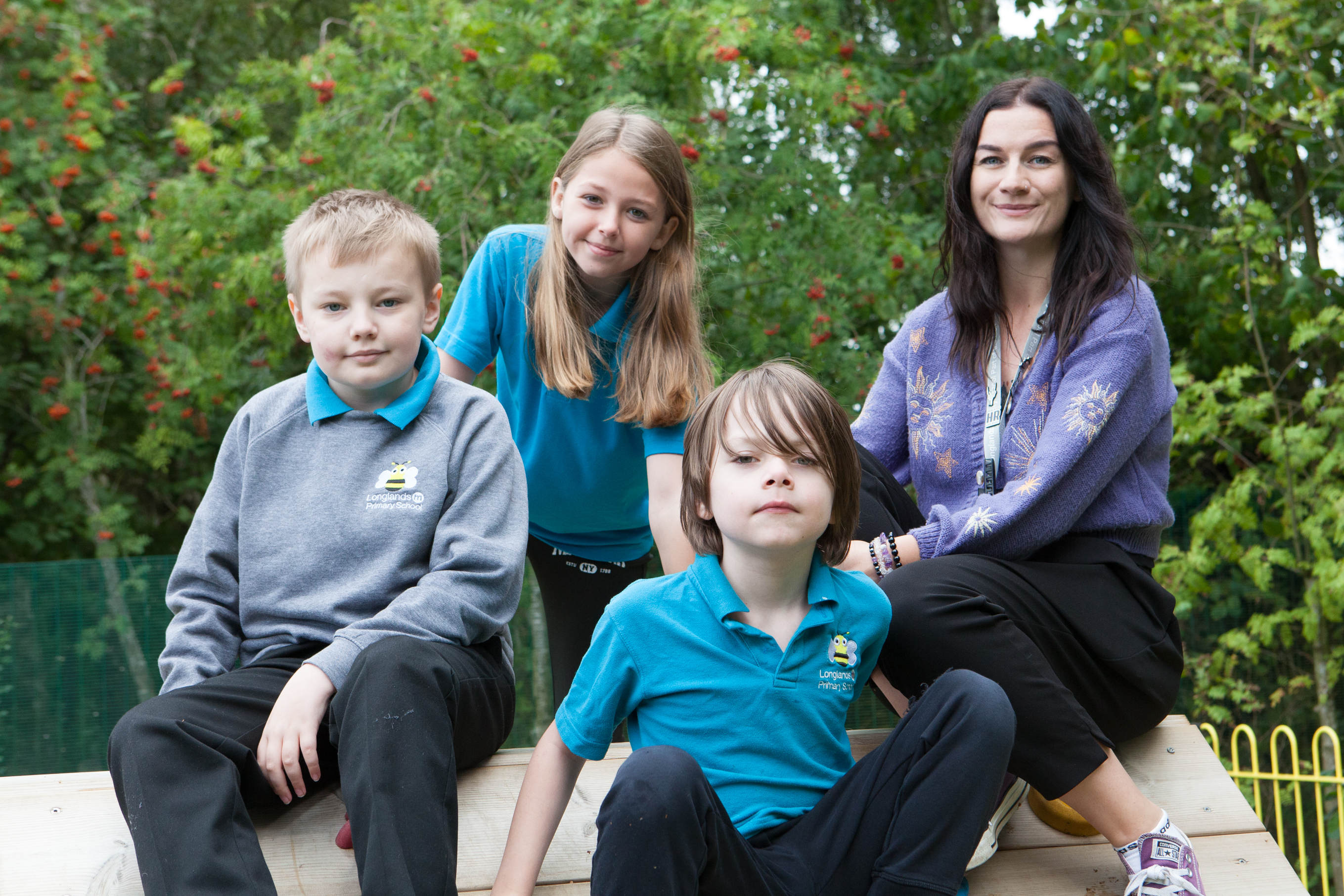 Pupils with a member of The Meadow staff outdoors.